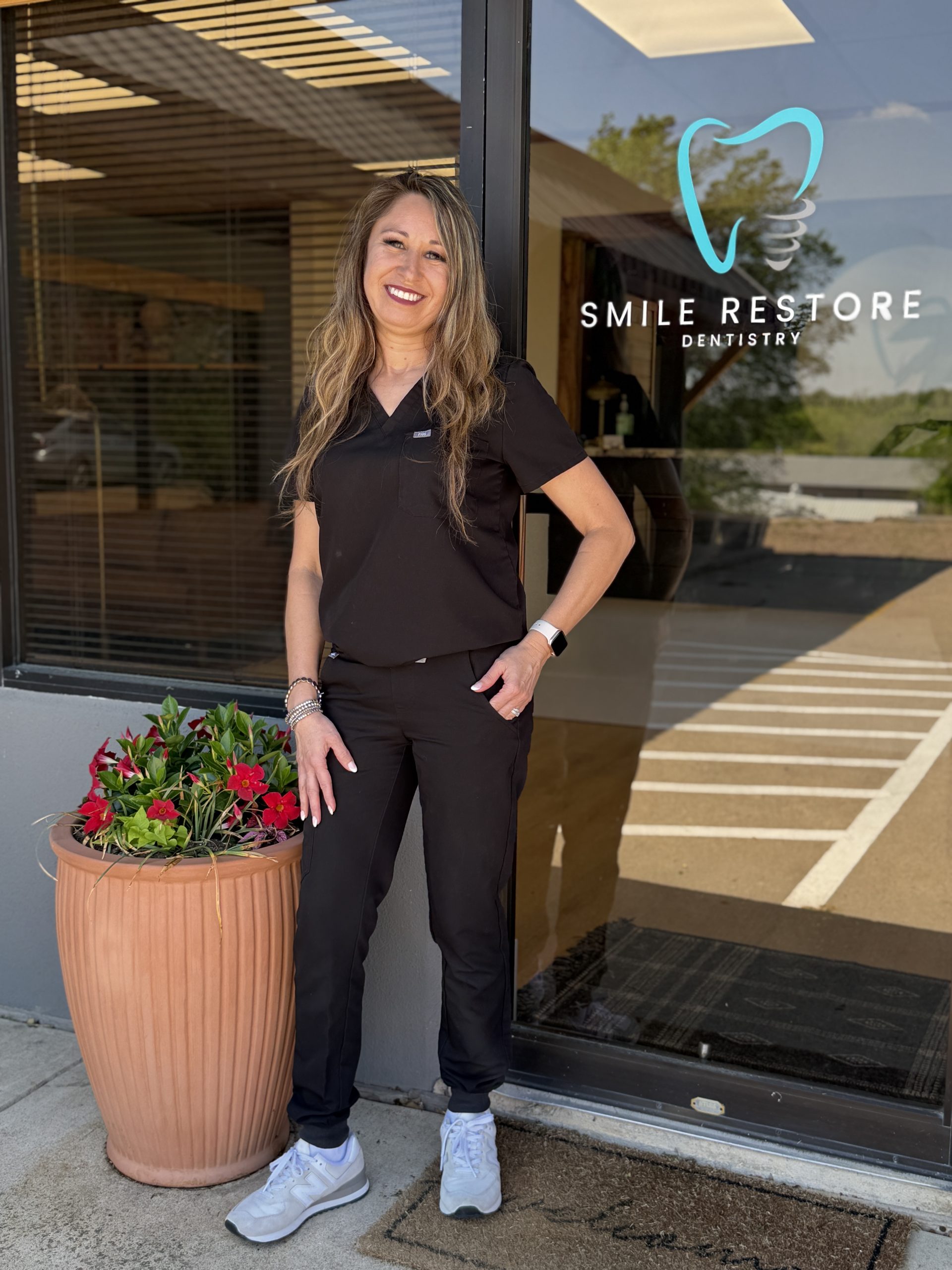dental office manager in front of fort worth dental office